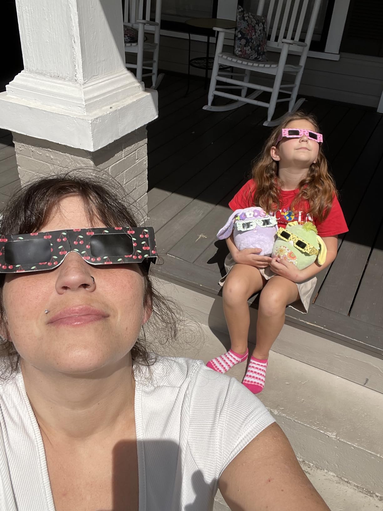 Family safely viewing the Sun with Tember fruit-design eclipse glasses